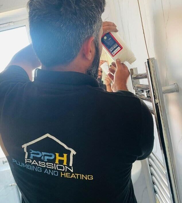 Noman from Passion Plumbing and Heating finishing a heated towel rail