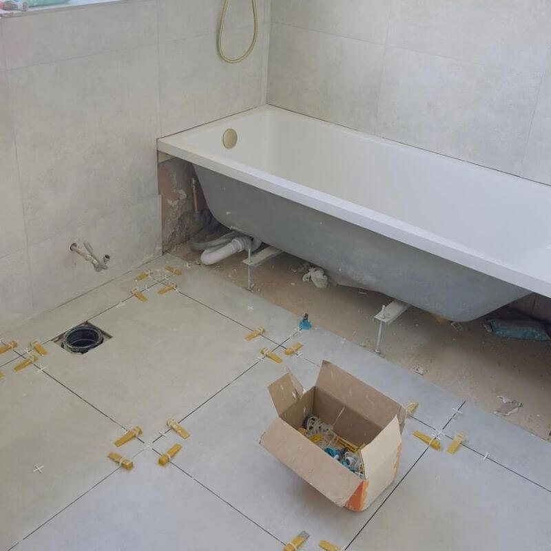 Bath in, floor tiles down