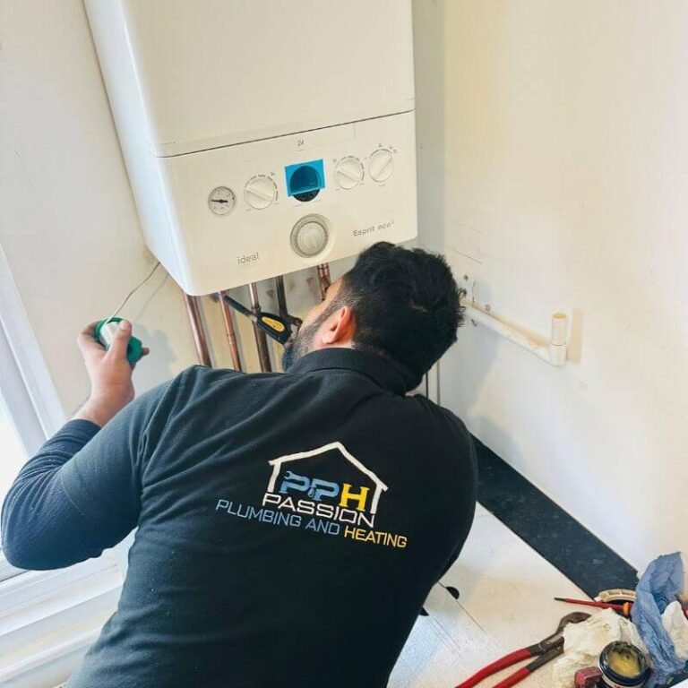 Passion Plumbing and Heating engineer working on an Ideal gas boiler in Wandsworth